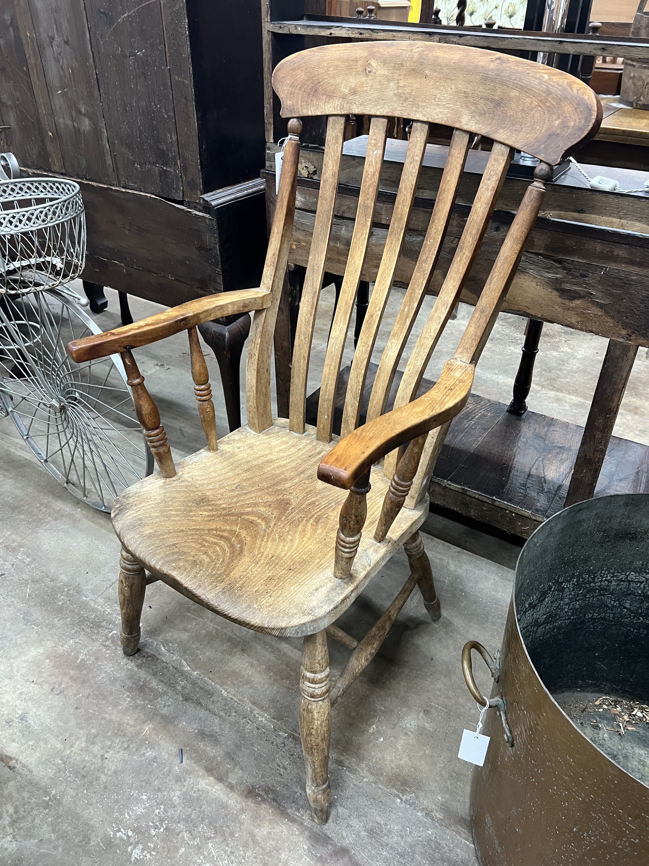 A Victorian elm and beech Windsor lathe back armchair, width 54cm, depth 47cm, height 110cm